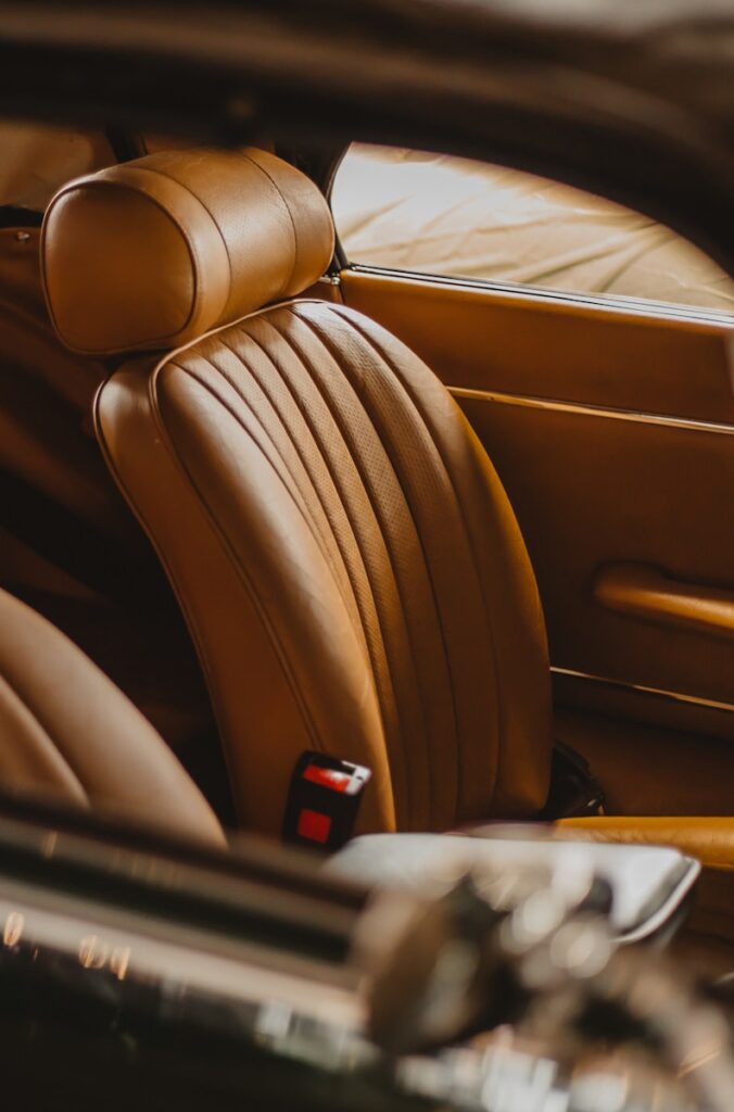 black remote control on brown leather car seat